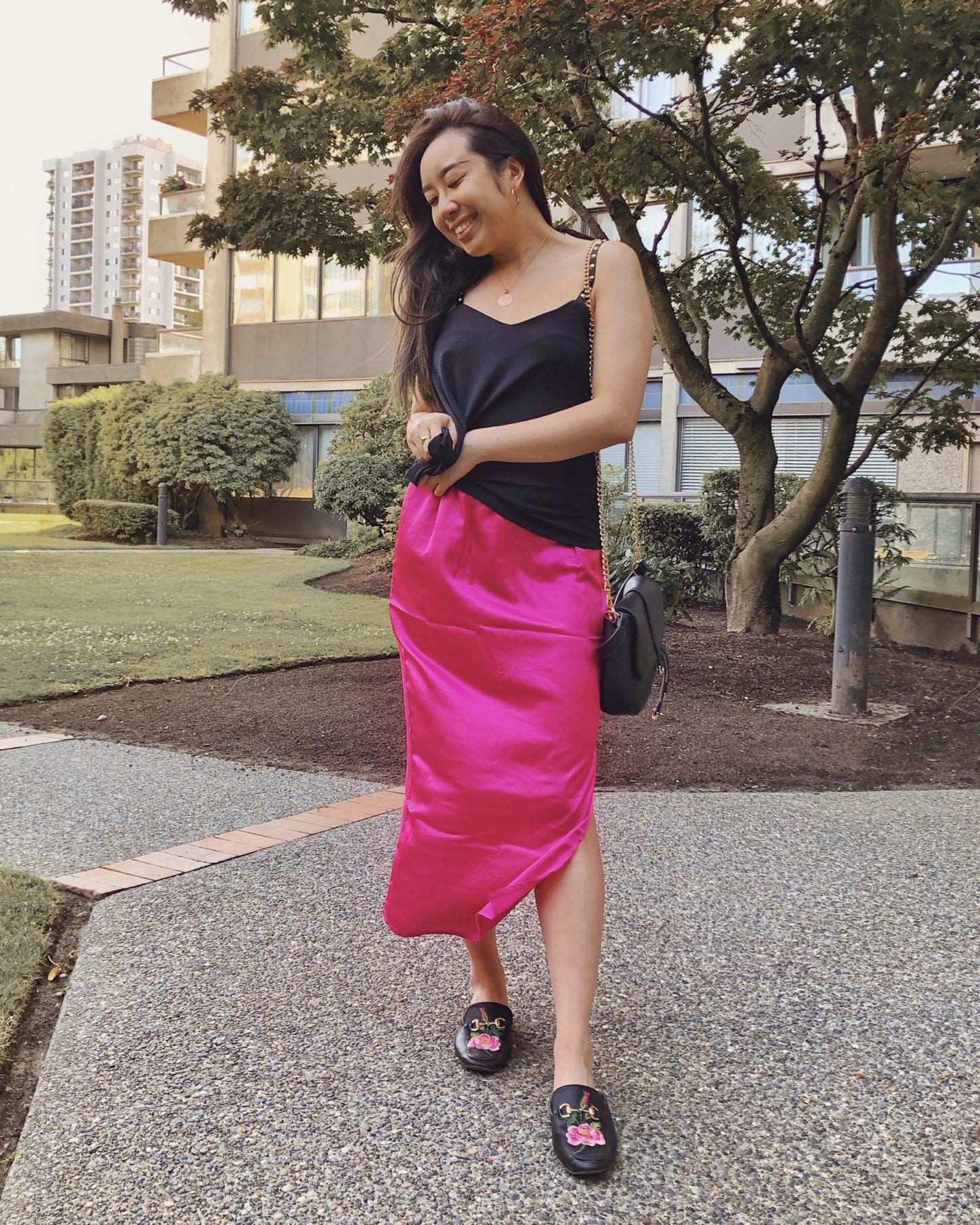 Smiling because this hot pink skirt is perfect for summer 