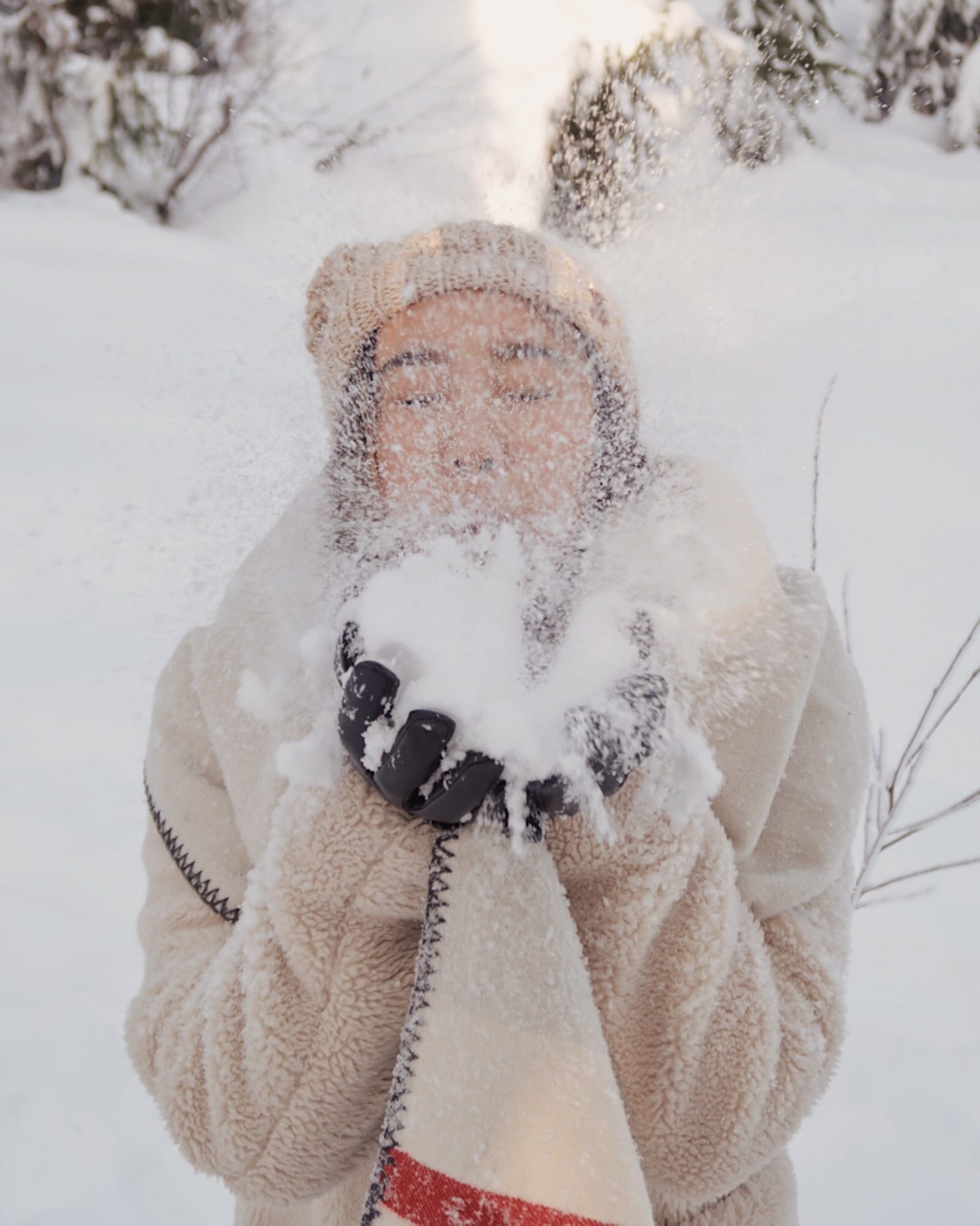 Cozy winter day in the snow blowing snow from my hands