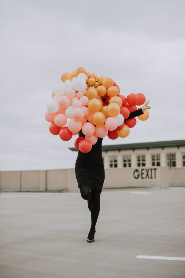 Posing with a bouquet of balloons in my little black dress for my 25th birthday