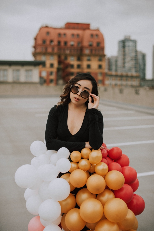 Posing with my balloon skirt and my favourite sunglasses for my ultimate birthday checklist 