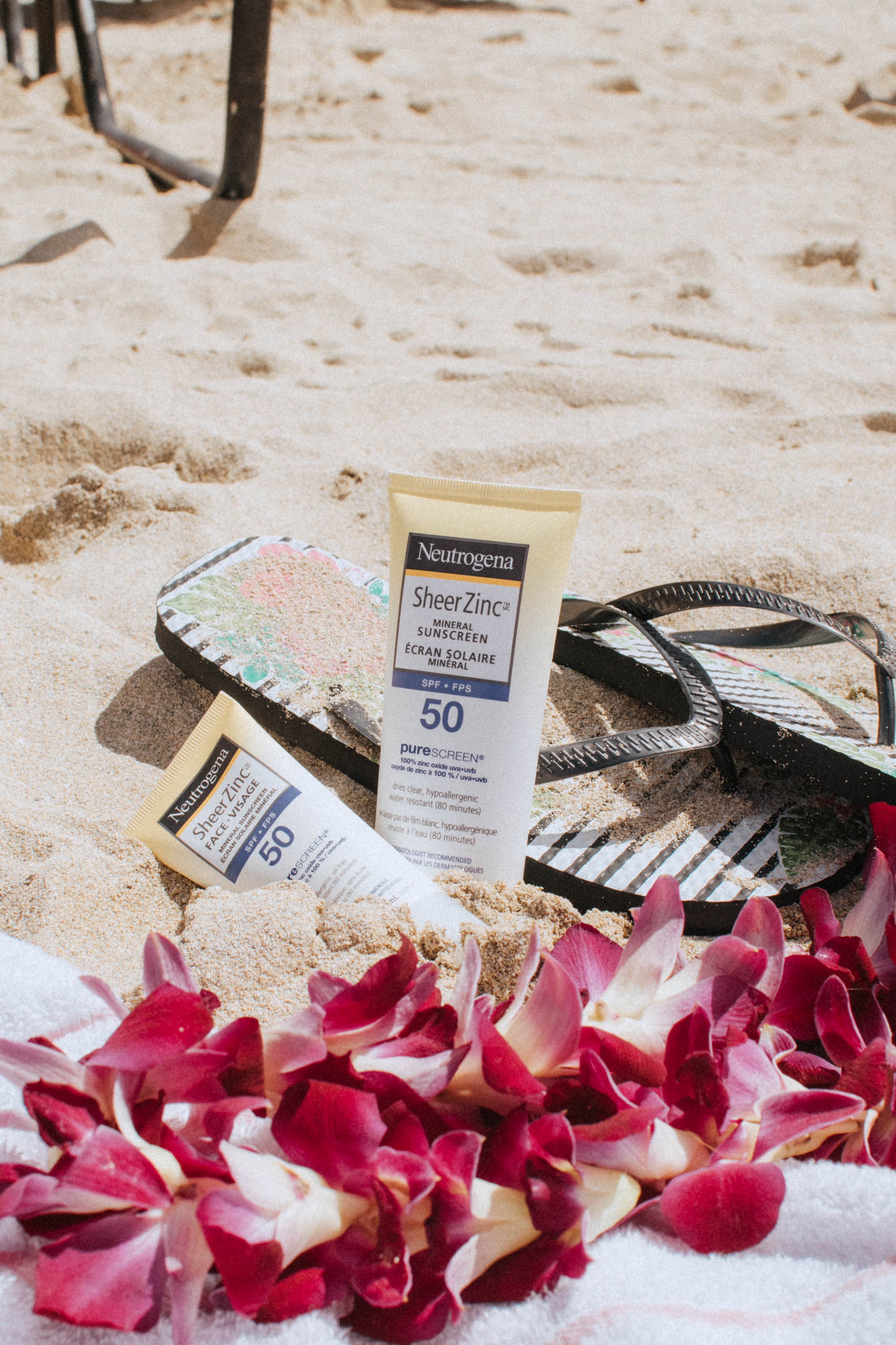 Displaying my favourite Neutrogena Sheer Zinc Mineral Sunscreen for Face and Body by the beach