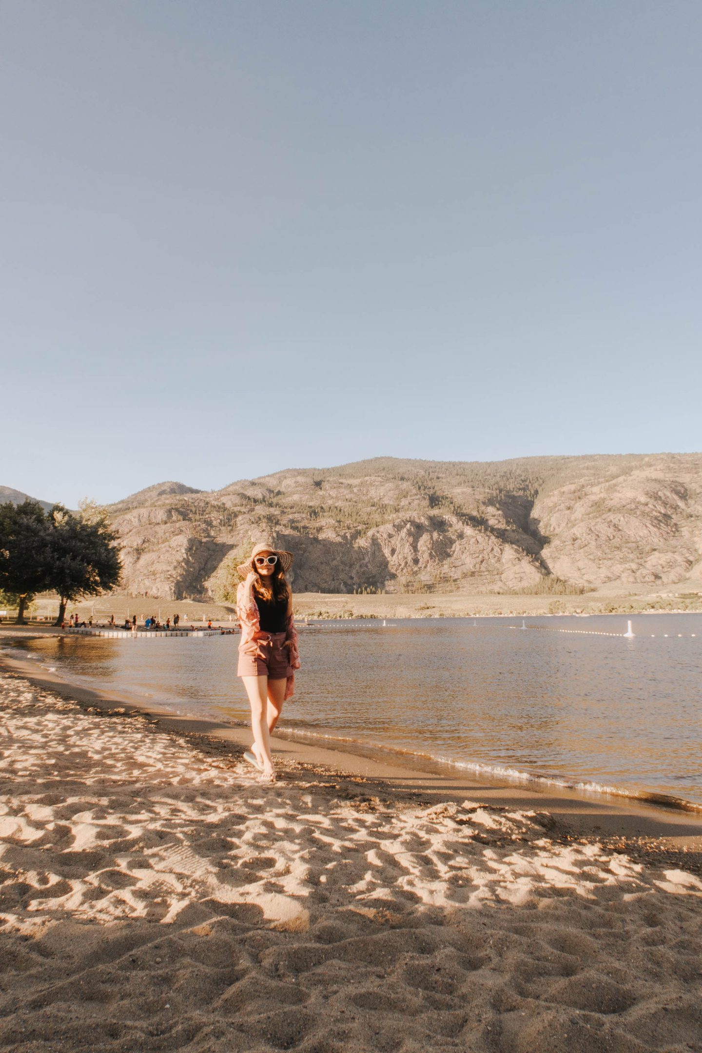 Strolling on the beach with mountain views at The Watermark Resort in Osoyoos BC Okanagan