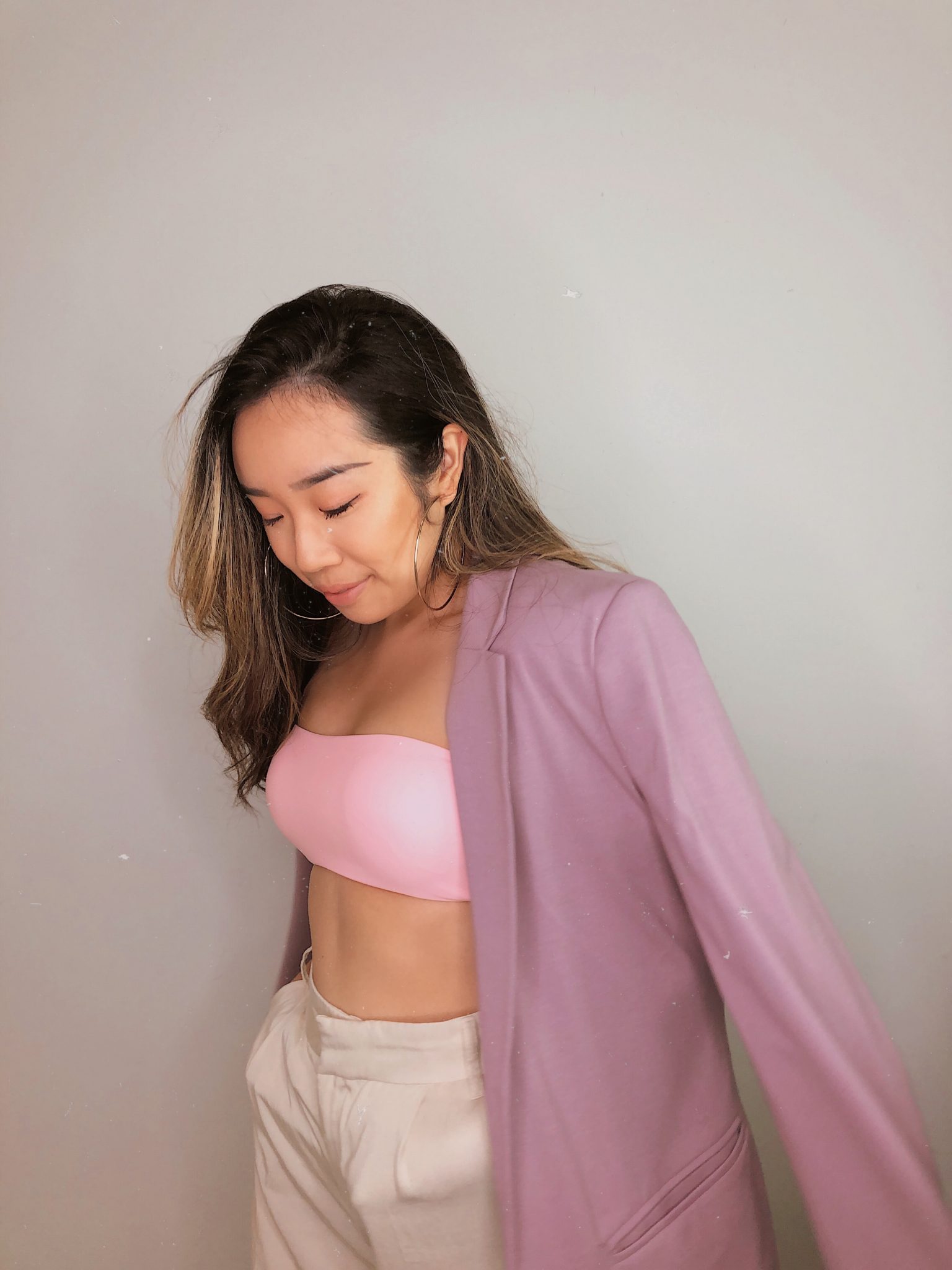 Pink swimwear top from Express Swimwear paired with a blazer