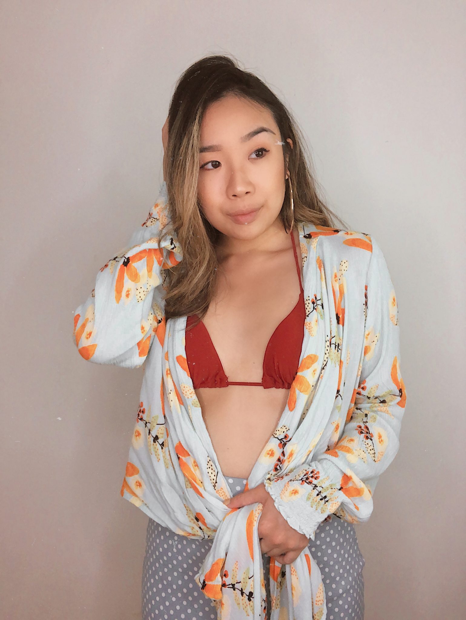 Pairing my red bikini top from express swimwear with a patterned button down shirt